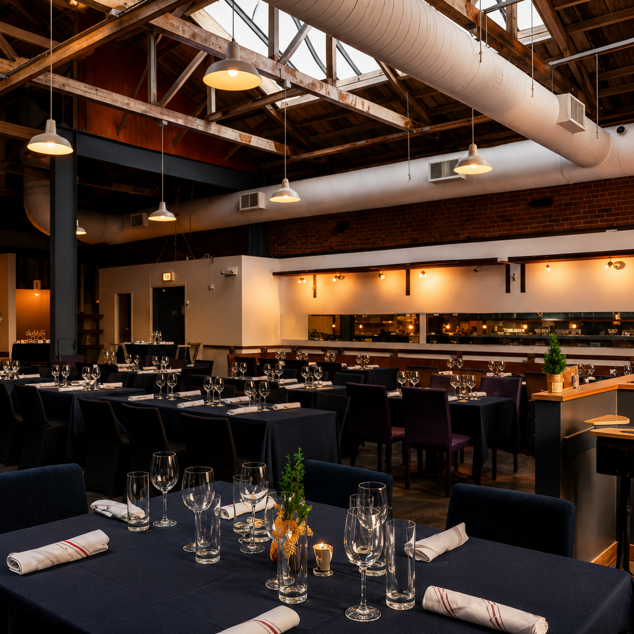 Seated dinner setup inside LongHouse, an industrial loft event venue in SoMa