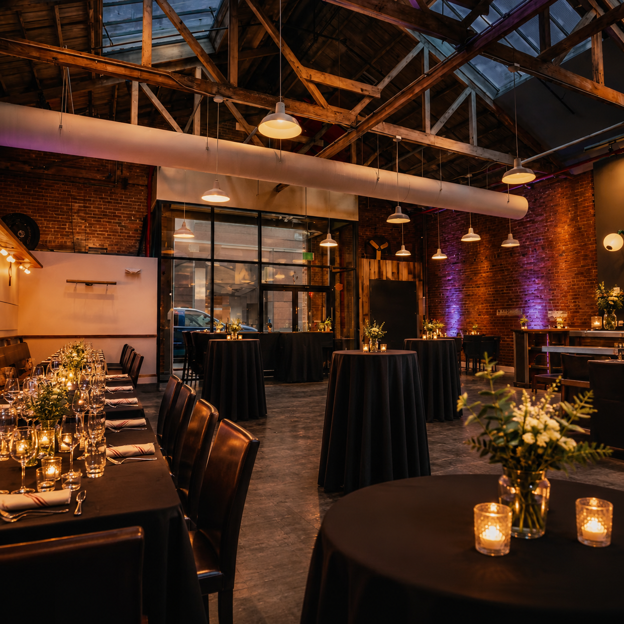 Seated dinner setup inside LongHouse, an industrial loft event venue in SoMa
